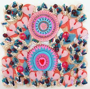 a 6x6-inch textile artwork in pinks and blues and a variety of shapes of fabric and stitching