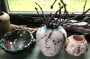 a photo of a Raku vase in brown and turquoise