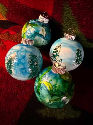a photo showing 4 alcohol ink Christmas Balls