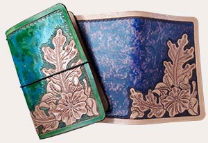 example of two notebook covers in oak and rose design in green and blue
