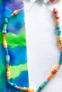 a beaded necklace made from recycled paper