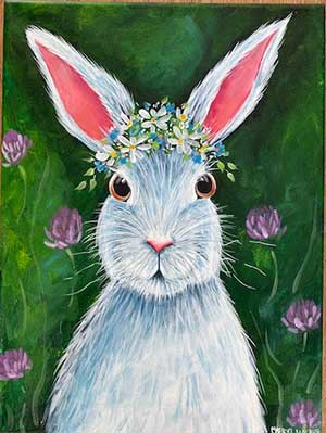 a painting of a bunny sitting in clover and wearing flowers on her head