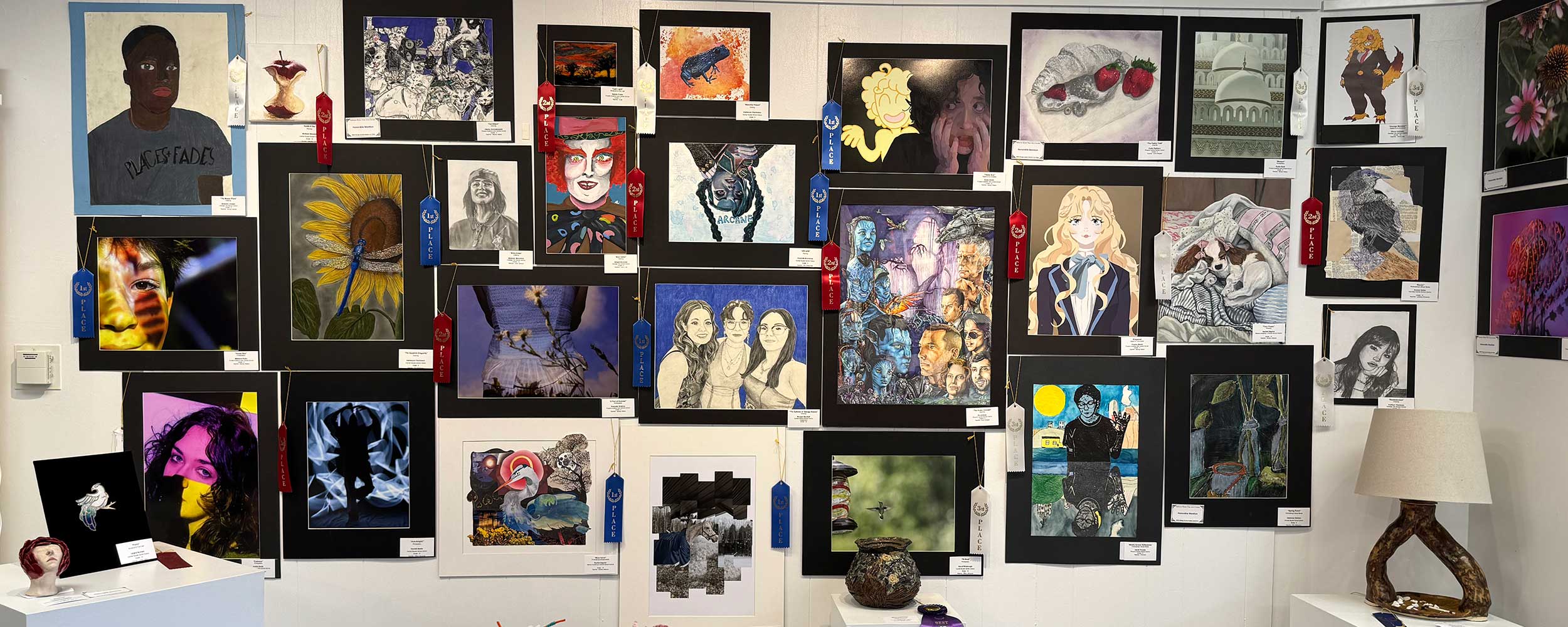 website banner showing many of the winners of the student art show and competition