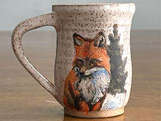 photo of a mug with an image of a fox on the front