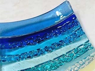 an example of a glass object that will be made in one of the 6x6 classes; the colors range from blues to aquas