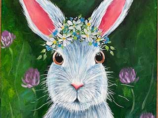 a painting of a bunny with flowers on the top of its head