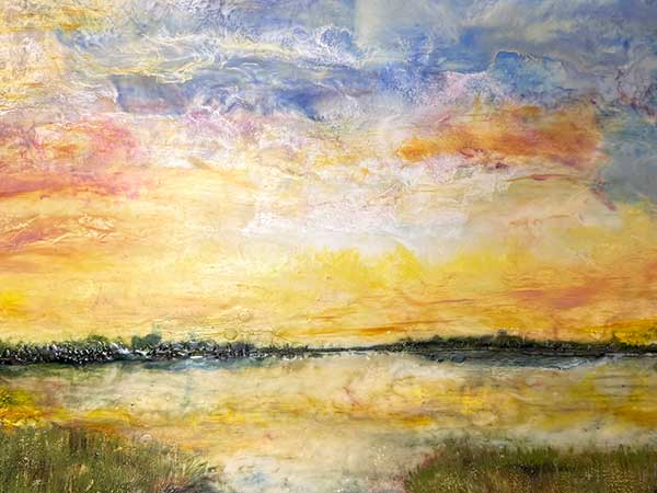 an encaustic painting of a sunrise or sunset over the Salmon River Estuary